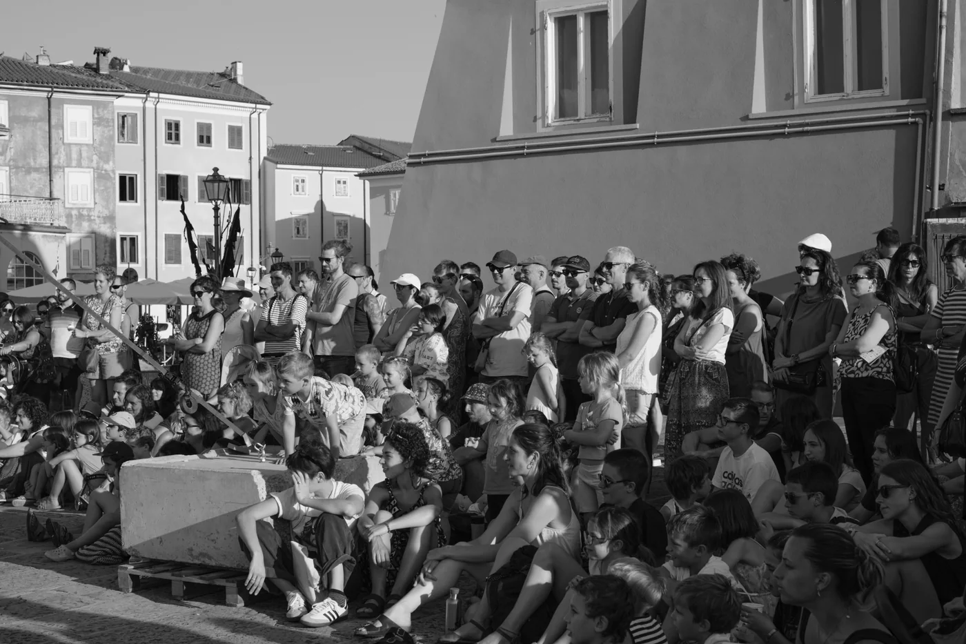A community gathered together in an open public square